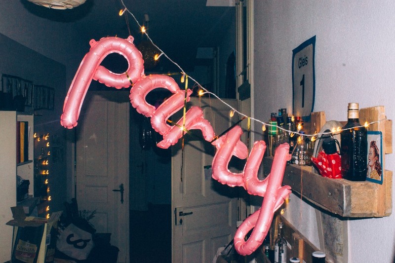 Bachelor party decorations with a banner and balloons