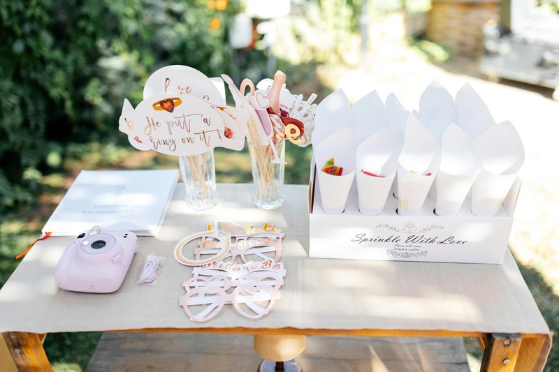 Colorful bachelorette party decorations and accessories arranged on a table
