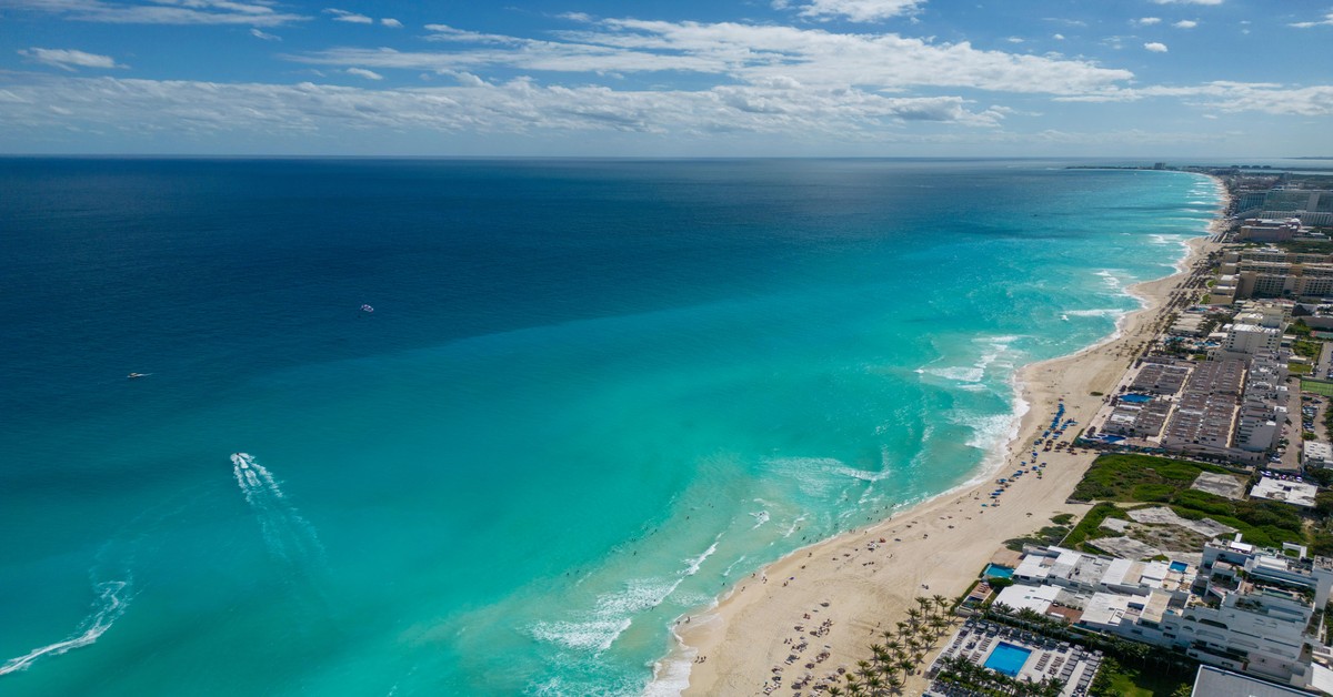 Aerial view of Cancun Hotel Zone beach with turquoise water and resorts