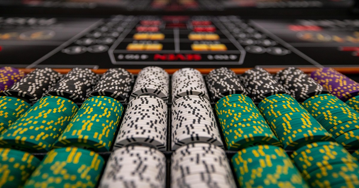 A casino night bachelor party setup with a poker table, chips, and cards ready for guests