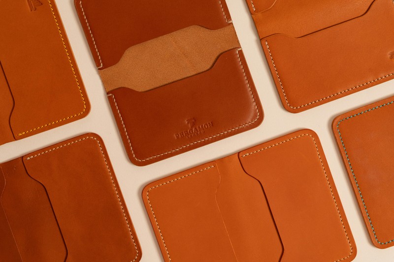 Set of custom engraved leather cardholders in brown and black with initials