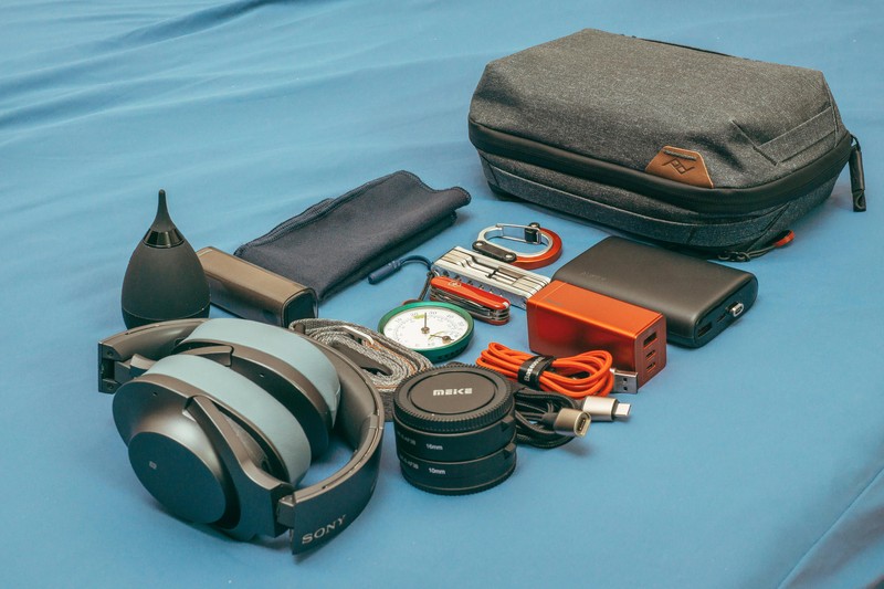 Essential Group Travel Gear Portable power bank and travel accessories on a table