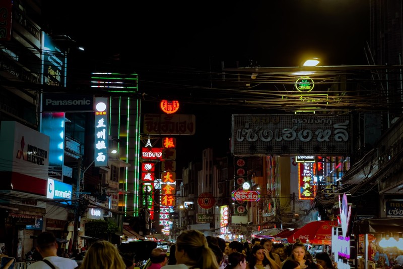 Nana Plaza Bangkok Nightlife Hub Nana Plaza neon lights and crowds outside the iconic three-story complex in Bangkok