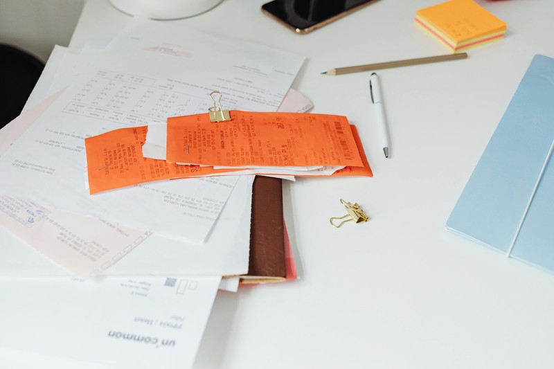 Organized travel insurance claim documents Organized travel insurance claim documents and receipts on a table